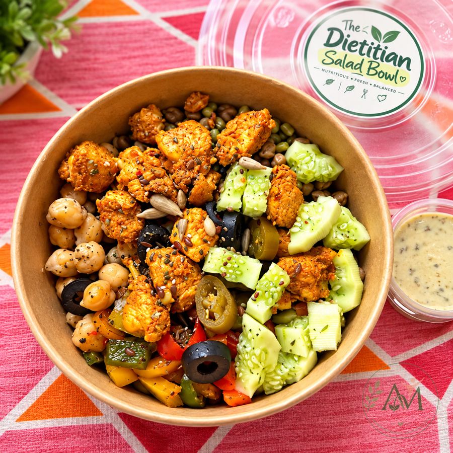 Chicken salad bowl with chickpeas, sprouts, cucumber, peppers and olives