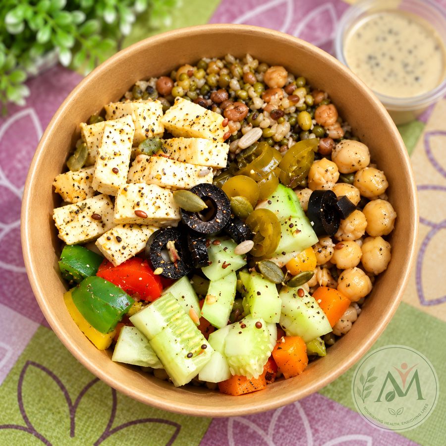 Paneer salad bowl with sprouts, chickpeas, cucumber, peppers and olives